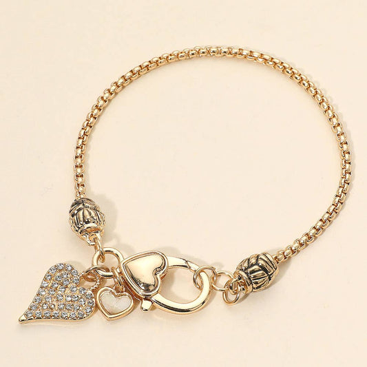 Elegant Crystal Accent Heart Charm Bracelet: Gold